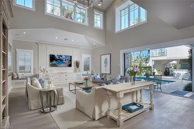 a living room with fireplace furniture and a flat screen tv