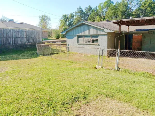 a house view with a backyard space