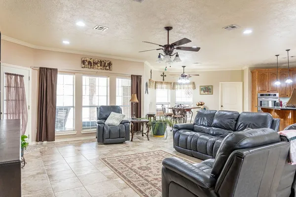 a living room with furniture and a large window