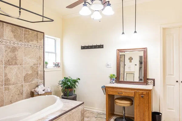 a bathroom with a sink a mirror and a bathtub