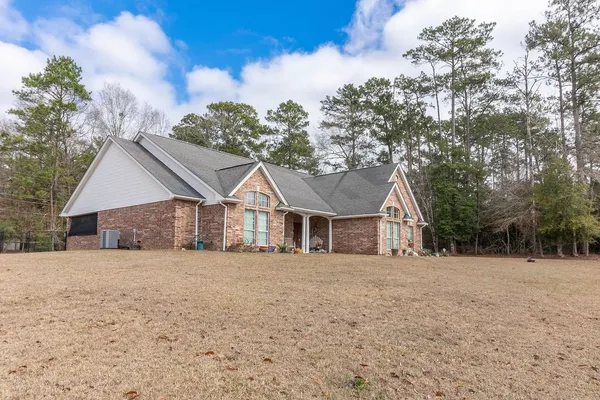 a front view of a house with a yard