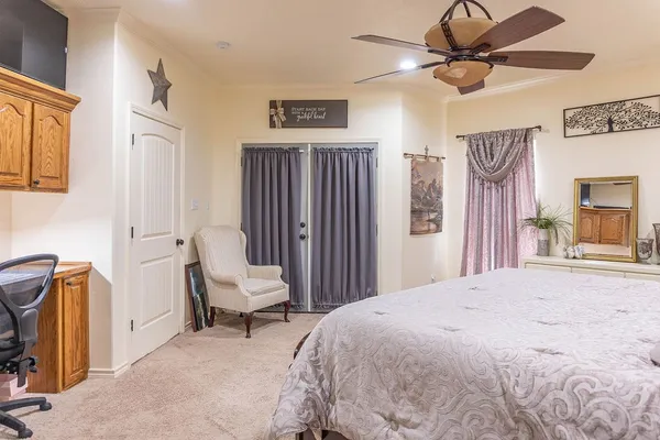 a bedroom with a bed furniture and a window