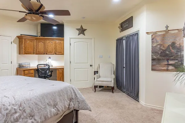 a bedroom with a bed and a view of bathroom