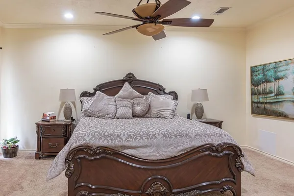 a bedroom with a bed and the view of bathroom