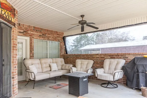 a front view of a building with outdoor seating