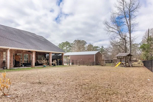 a view of a chairs and table in the patio