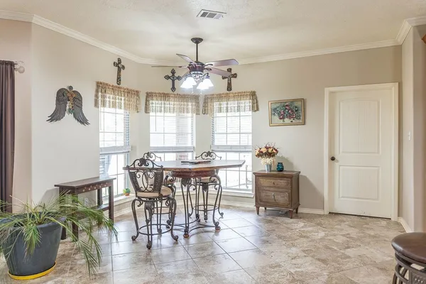 a view of a dining room with furniture window and outside view