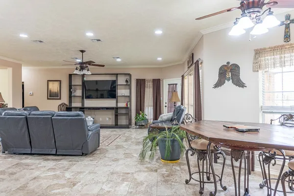 a living room with furniture and flat screen tv
