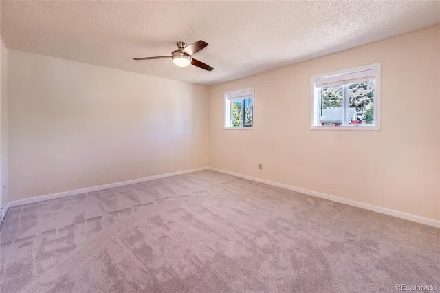 an empty room with a empty space and a window