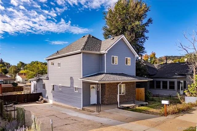 a front view of a house with yard
