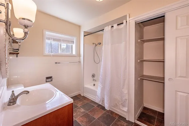 a bathroom with a toilet and shower