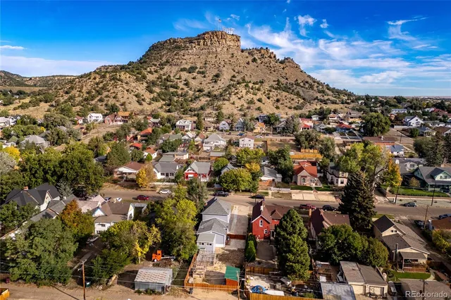 an aerial view of a house with a yard