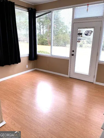 a kitchen with granite countertop a stove and cabinets