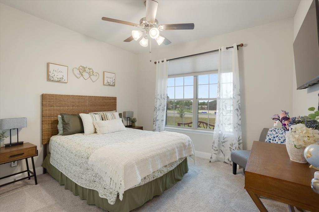 1205 Redbud Street Howe, TX 75459 - Photo 24 of 40 a bedroom with a large bed and a window