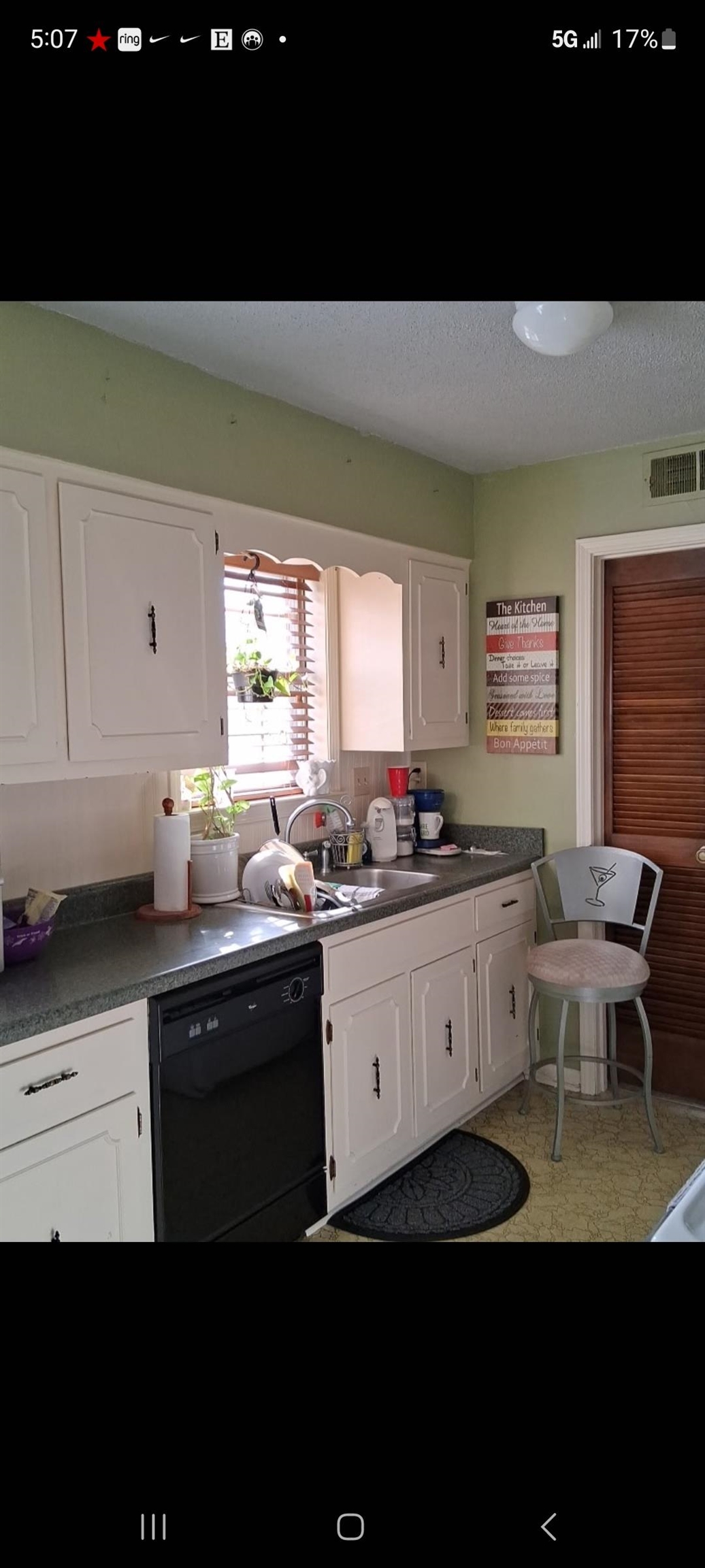 3220 Canyon Road Memphis, TN 38134 - Photo 9 of 16 Kitchen with white cabinets, black dishwasher, dark countertops, and a textured ceiling