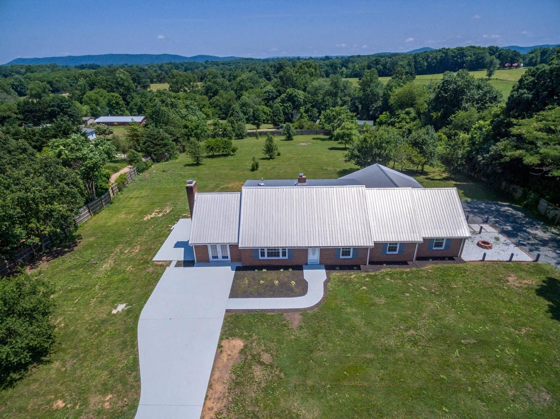 an aerial view of a house and garden