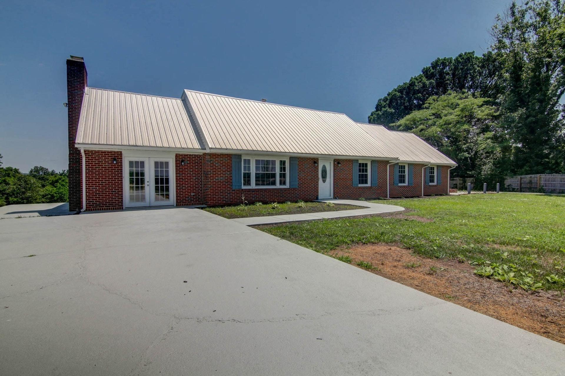 452 Lucy Wade Road Rocky Mount, VA 24151 - Photo 2 of 74 a front view of a house with a yard