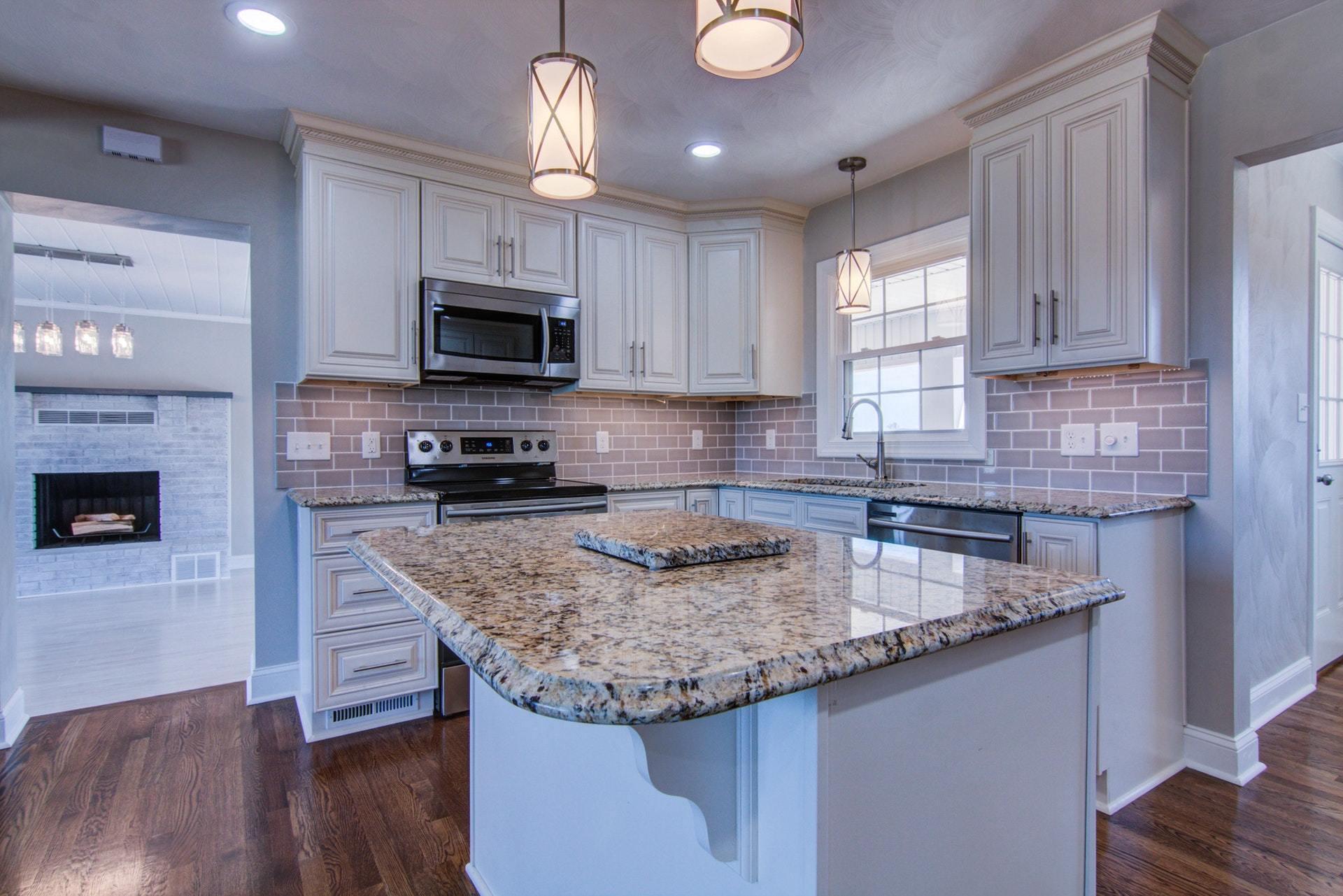 452 Lucy Wade Road Rocky Mount, VA 24151 - Photo 11 of 74 a kitchen with granite countertop a sink a counter space appliances and cabinets