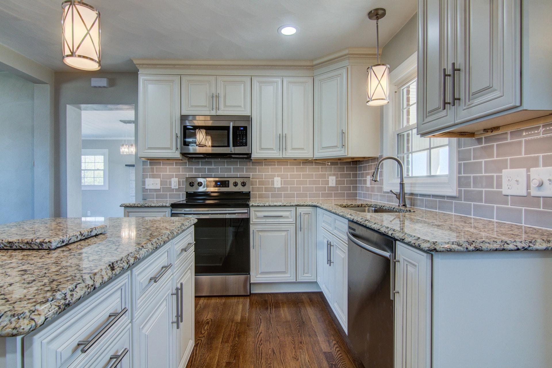 452 Lucy Wade Road Rocky Mount, VA 24151 - Photo 12 of 74 a kitchen with stainless steel appliances granite countertop a sink stove and cabinets
