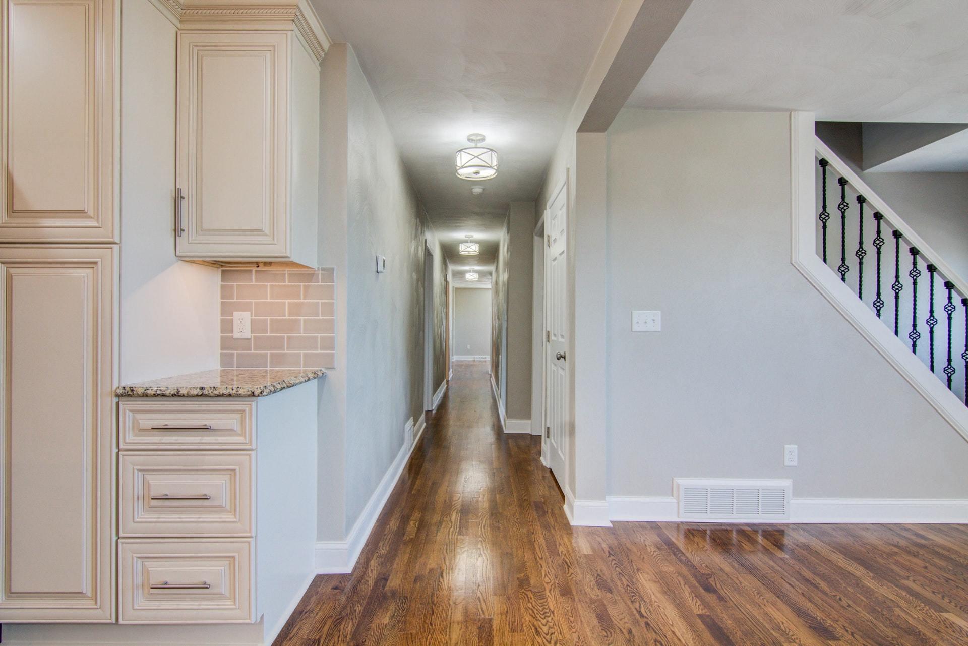 452 Lucy Wade Road Rocky Mount, VA 24151 - Photo 19 of 74 a view of a hallway with wooden floor and staircase