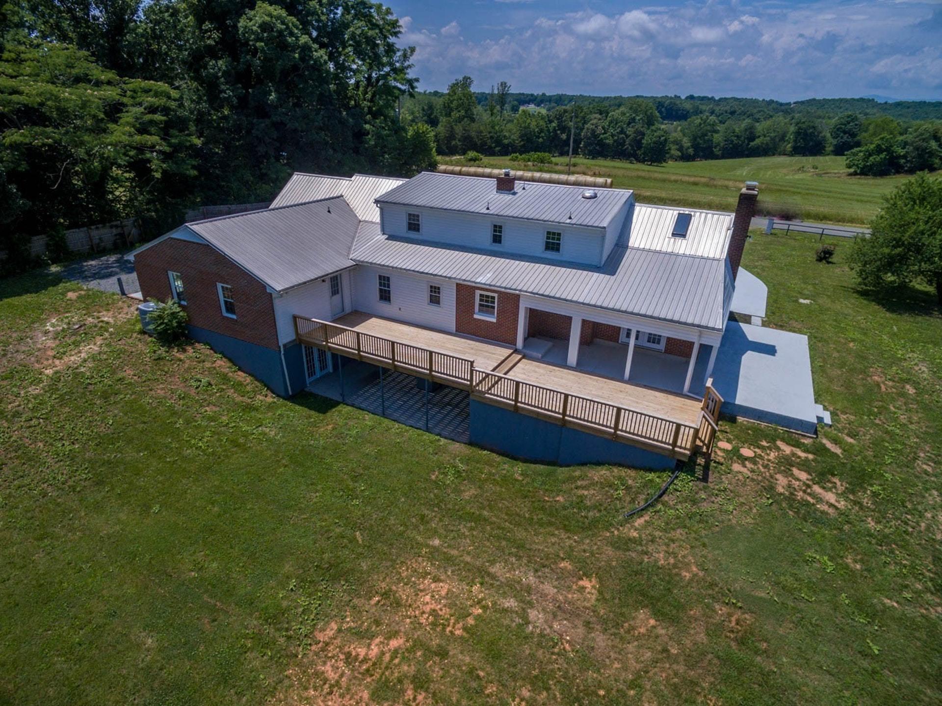 452 Lucy Wade Road Rocky Mount, VA 24151 - Photo 3 of 74 a aerial view of a house with a garden and a yard