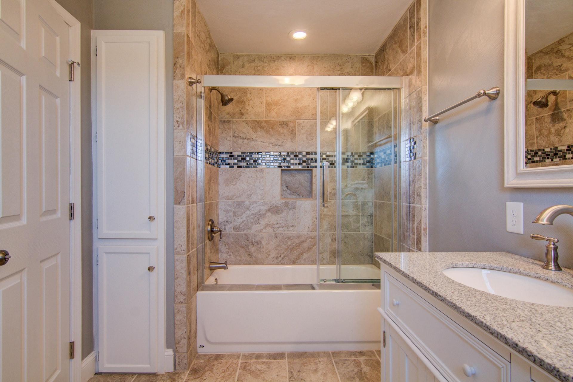 452 Lucy Wade Road Rocky Mount, VA 24151 - Photo 23 of 74 a bathroom with a granite countertop bathtub shower sink vanity and toilet
