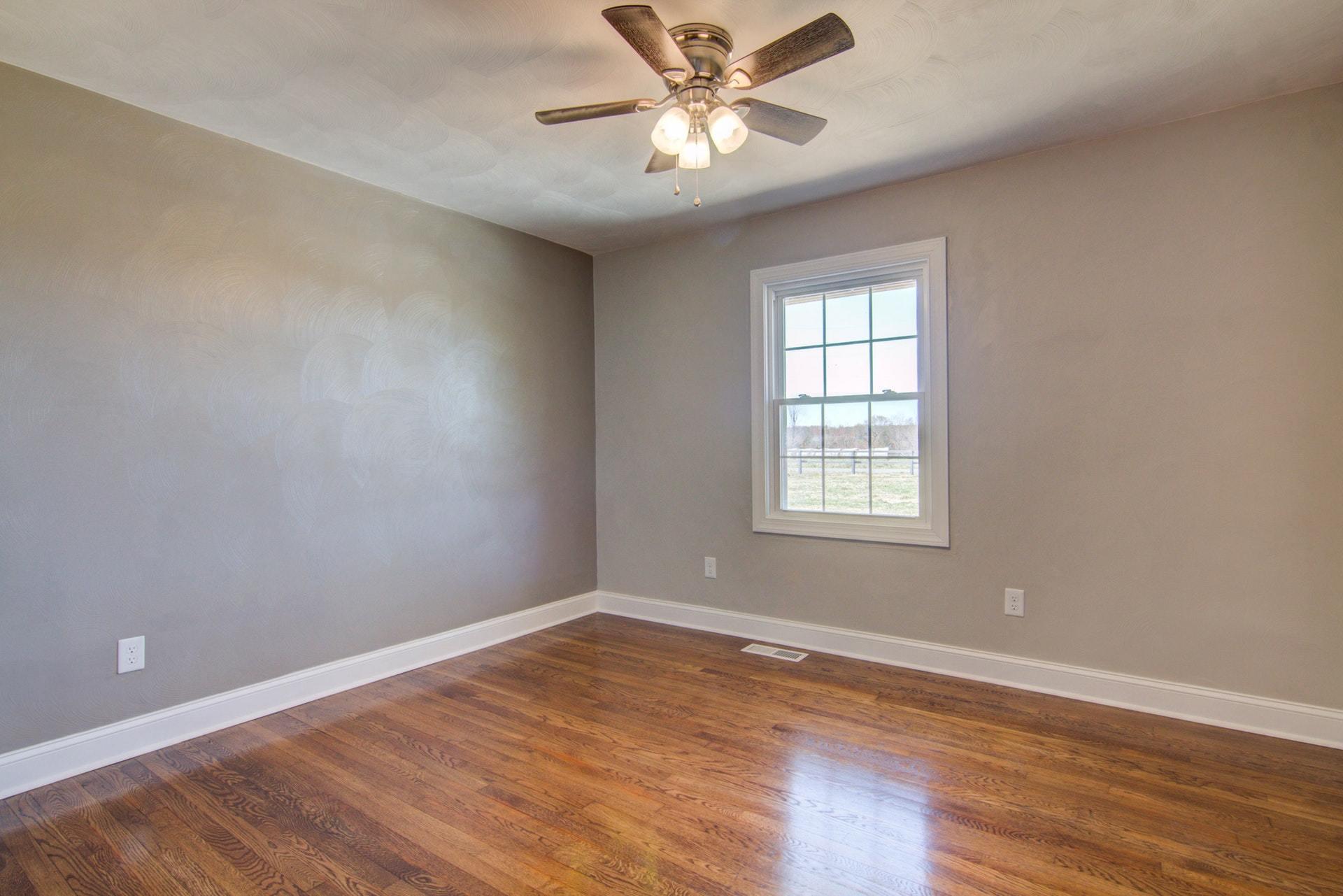 452 Lucy Wade Road Rocky Mount, VA 24151 - Photo 24 of 74 a view of a room with wooden floor and a ceiling fan
