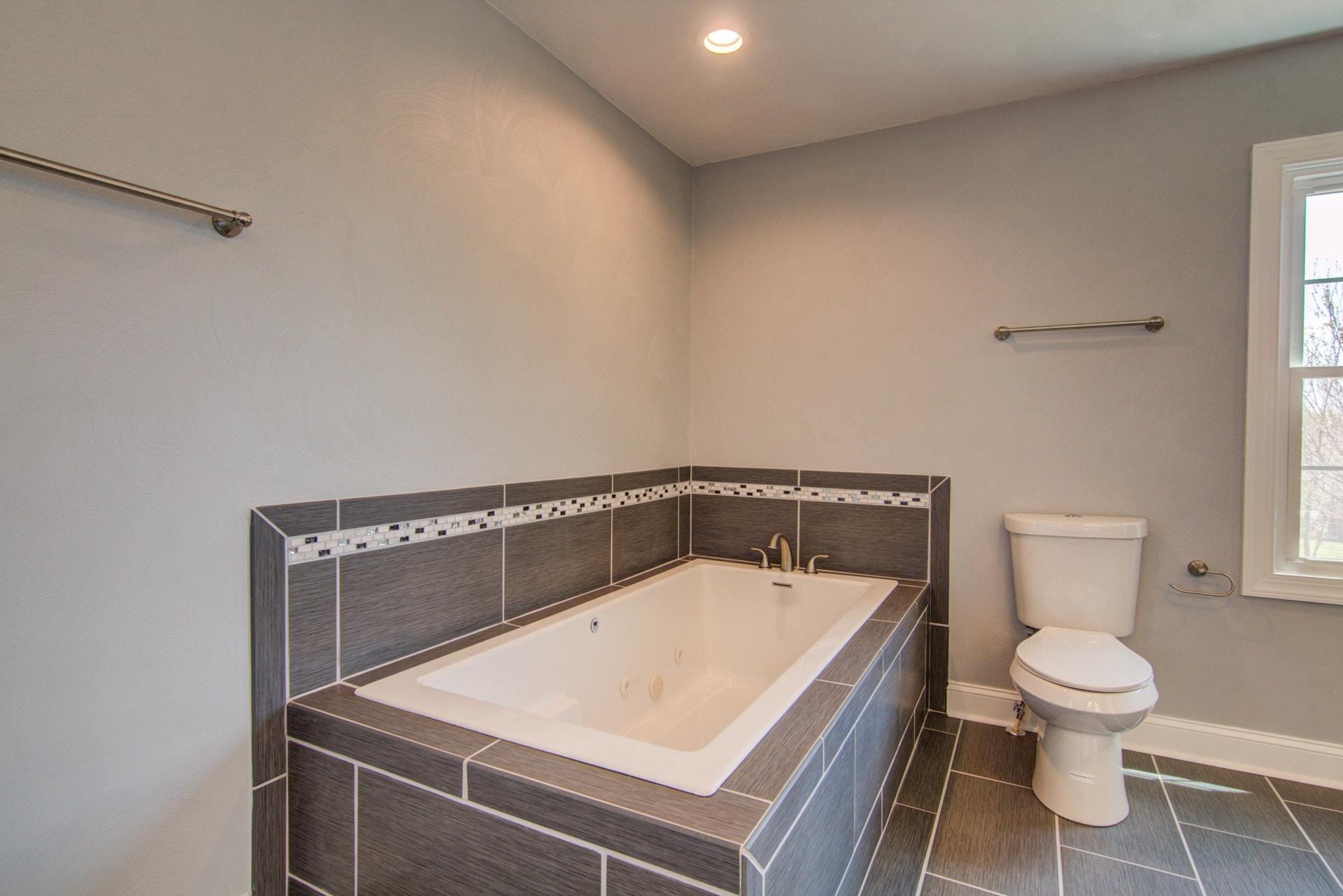452 Lucy Wade Road Rocky Mount, VA 24151 - Photo 38 of 74 a white toilet sitting next to a bathroom sink