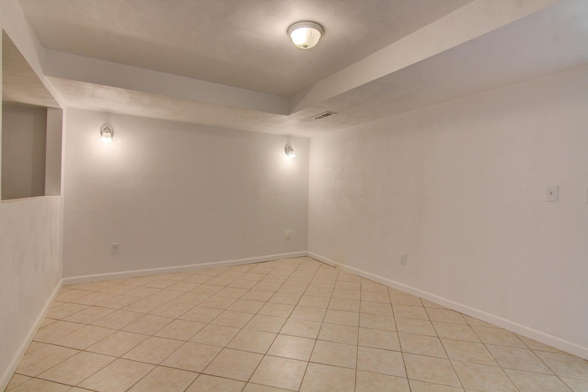 452 Lucy Wade Road Rocky Mount, VA 24151 - Photo 46 of 74 an empty room with white walls and tiles