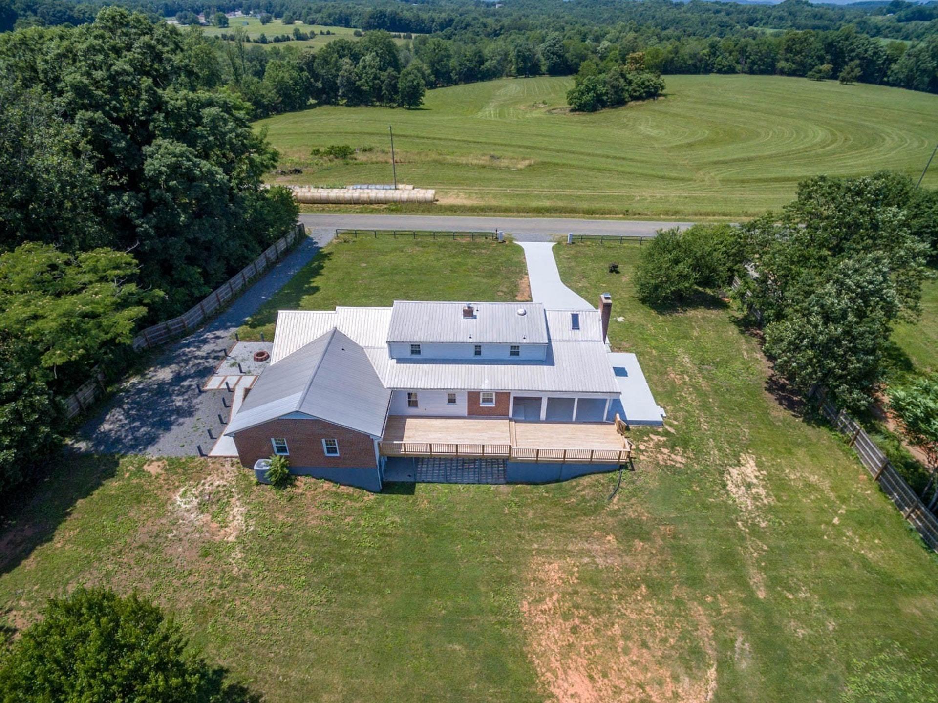452 Lucy Wade Road Rocky Mount, VA 24151 - Photo 61 of 74 a aerial view of a house with a yard