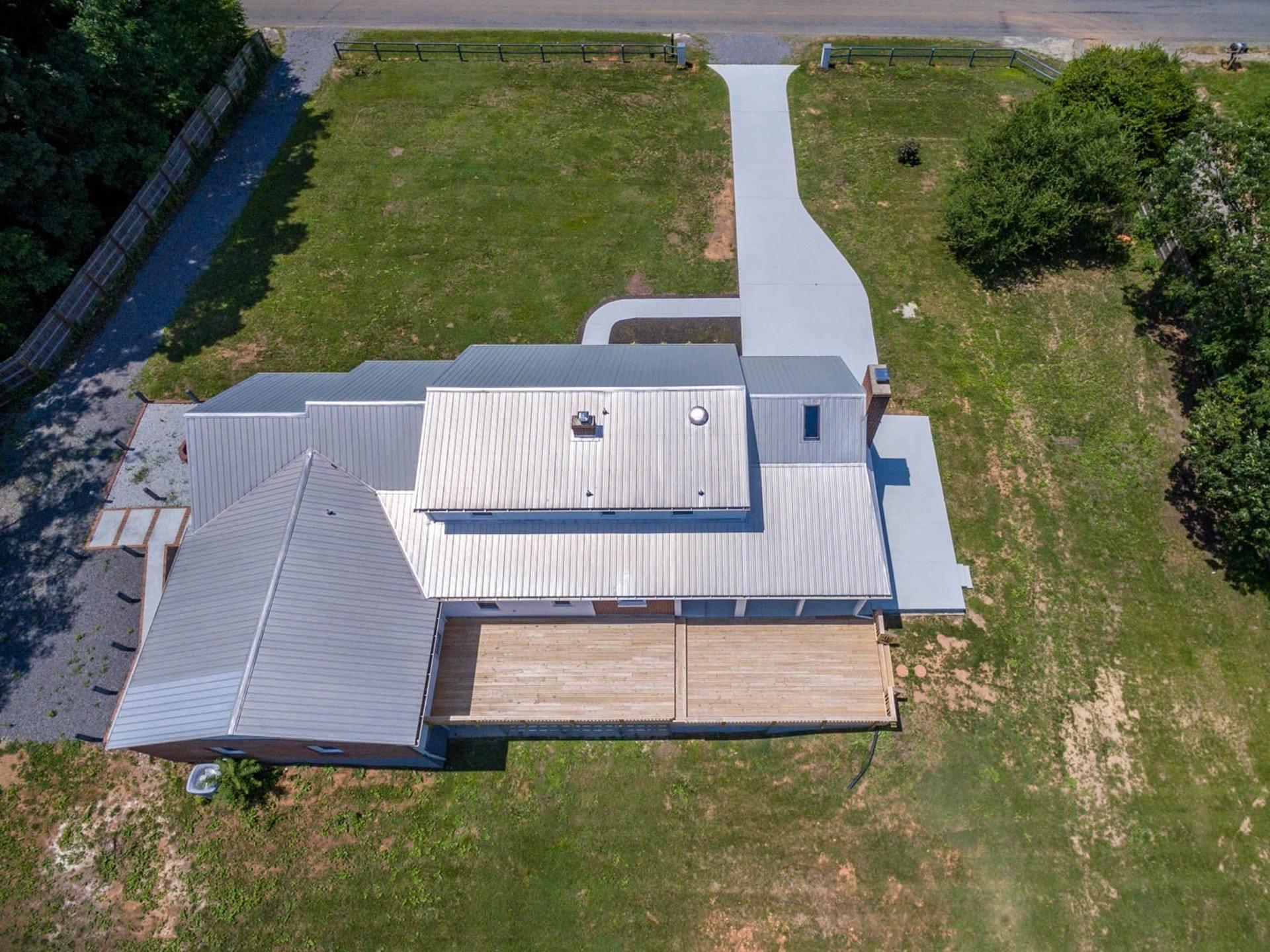 452 Lucy Wade Road Rocky Mount, VA 24151 - Photo 62 of 74 an aerial view of a house with a yard