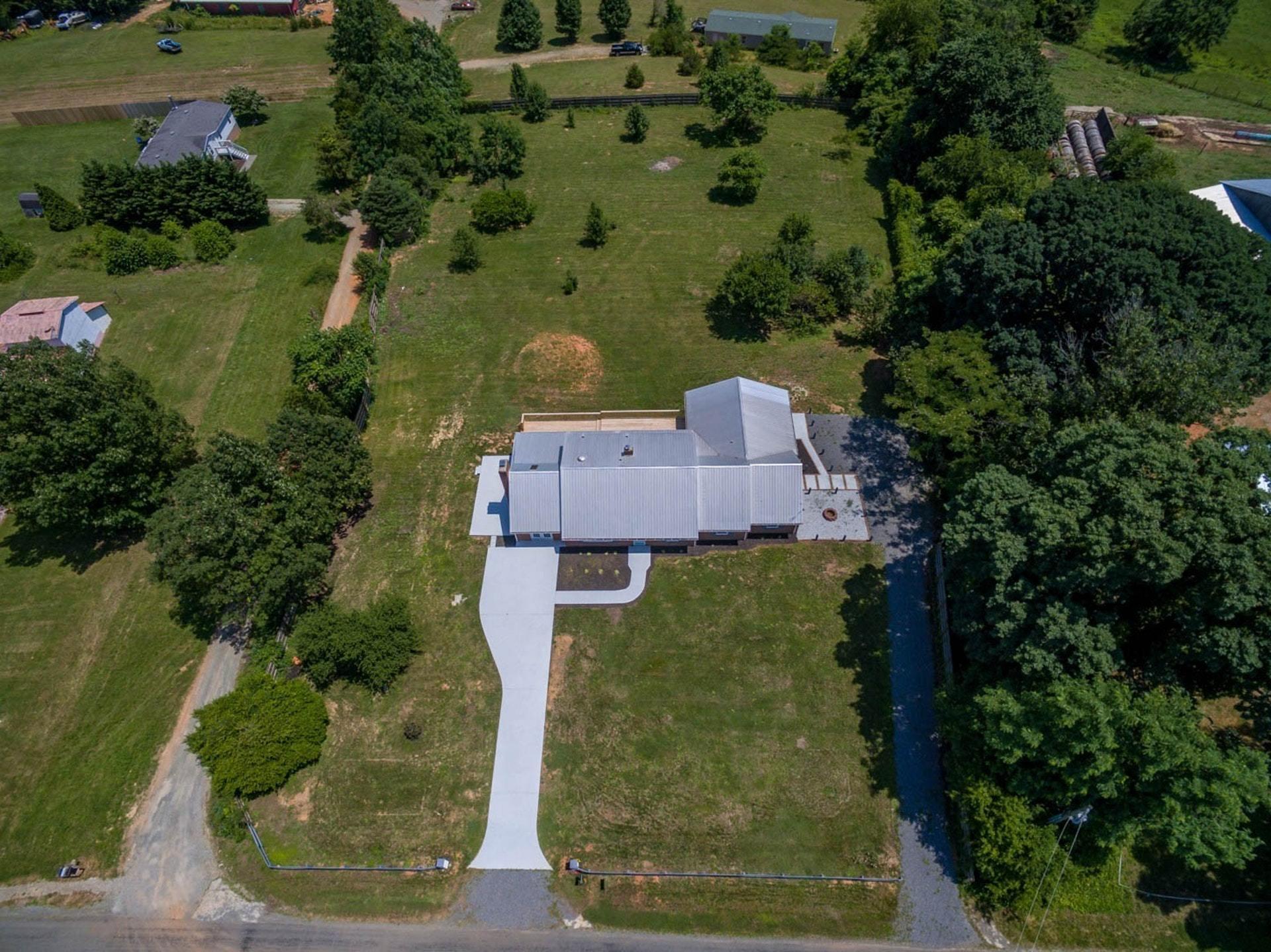 452 Lucy Wade Road Rocky Mount, VA 24151 - Photo 64 of 74 an aerial view of a house with a yard