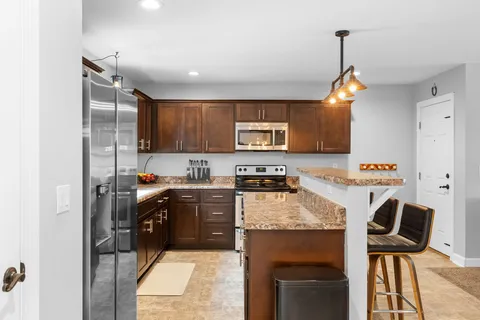 a view of a kitchen from the hallway
