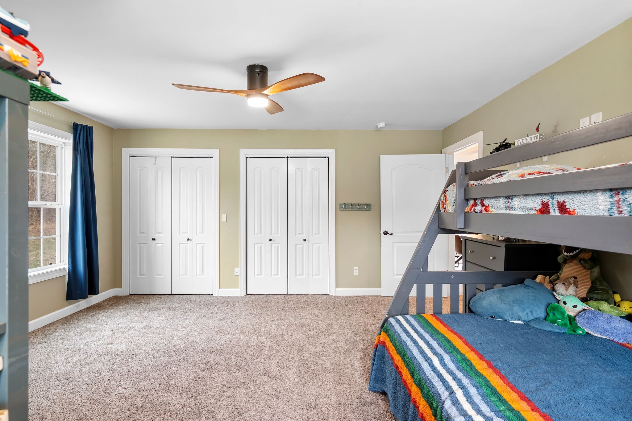 7401 Burks Hollow Road Christiana, TN 37037 - Photo 32 of 56 a bedroom with furniture and a book shelf