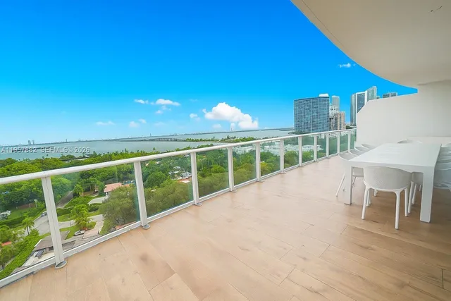 a kitchen with sink and view of living room