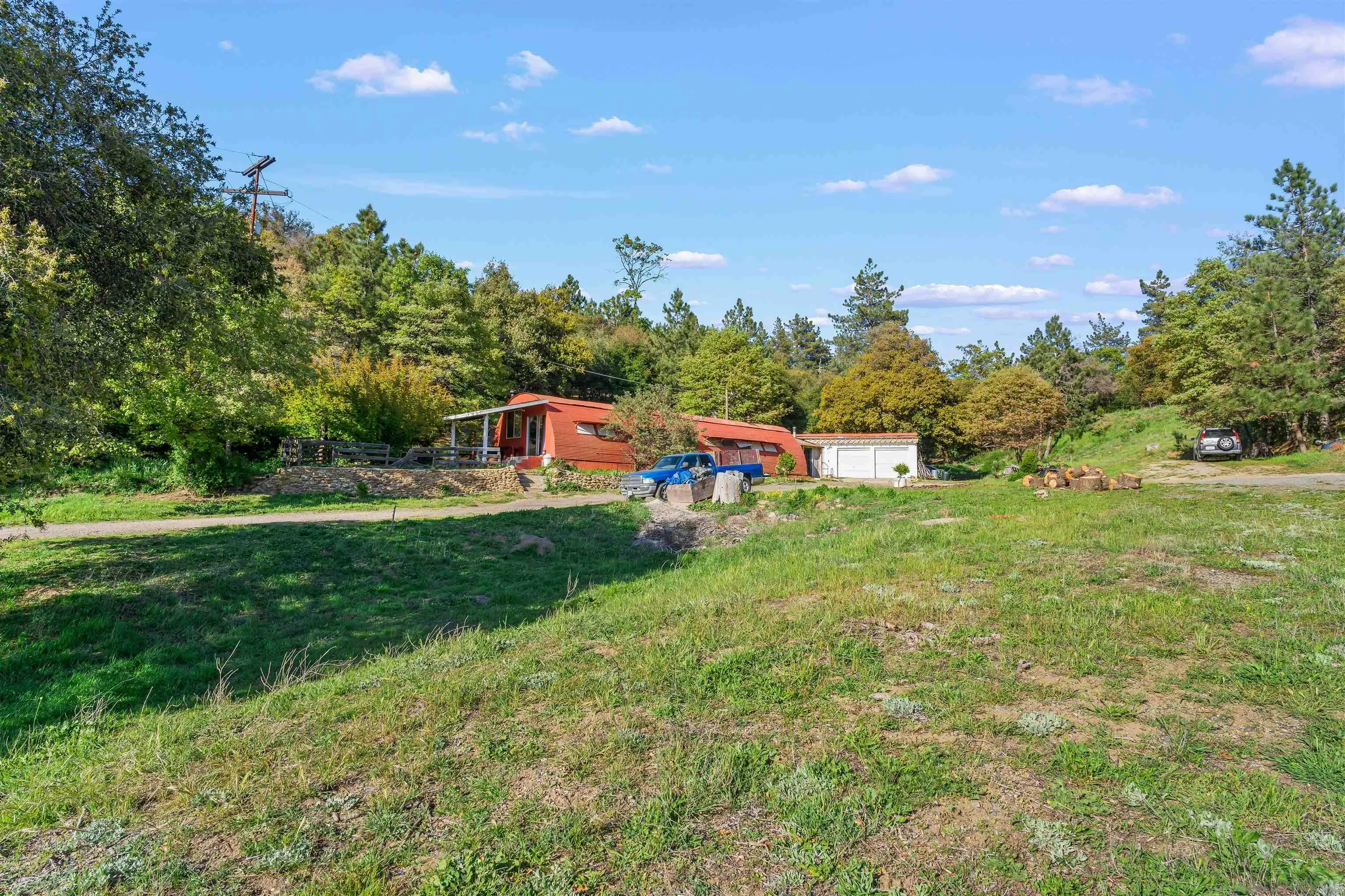 2464 Wynola Road Julian, CA 92036 - Photo 42 of 50 a view of a house with a yard