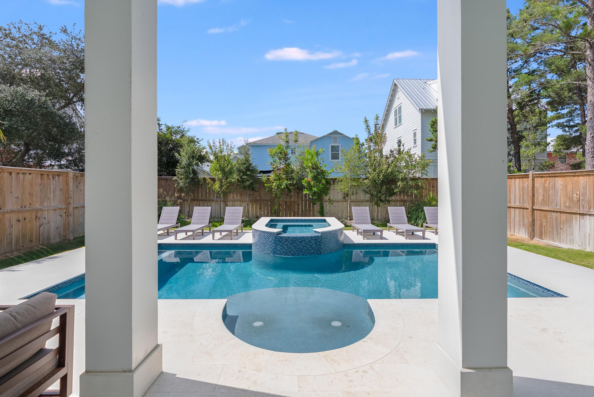 212 South Gulf Drive Santa Rosa Beach, FL 32459 - Photo 17 of 68 a view of a swimming pool and lounge chair