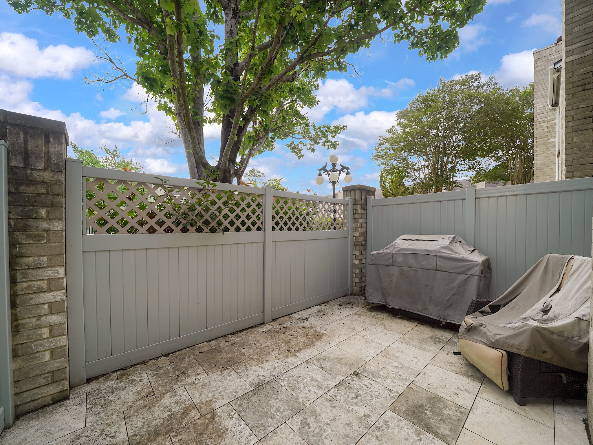 6000 Reims Road, Unit 2205 Houston, TX 77036 - Photo 28 of 35 Quiet rear patio providing a private outdoor retreat.
