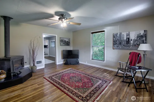 a living room with furniture and a rug
