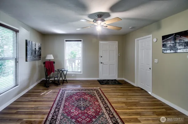 a living room with furniture and a rug