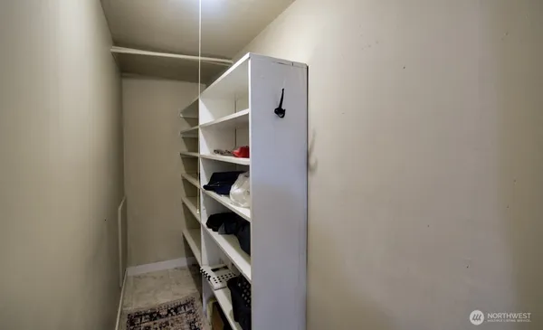 a view of a storage & utility room with a sink