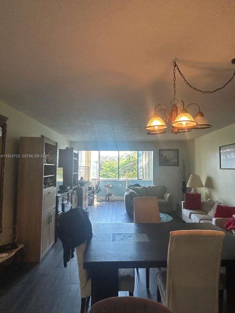 8020 Hampton Boulevard, Unit 202 North Lauderdale, FL 33068 - Photo 14 of 26 a view of a dining room with furniture window and outside view