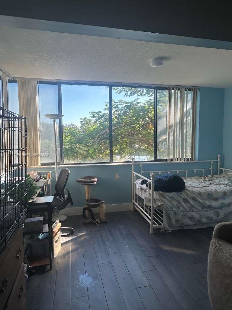 8020 Hampton Boulevard, Unit 202 North Lauderdale, FL 33068 - Photo 15 of 26 a living room with furniture and large windows