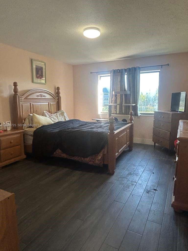 8020 Hampton Boulevard, Unit 202 North Lauderdale, FL 33068 - Photo 17 of 26 a room with a bed and a couch