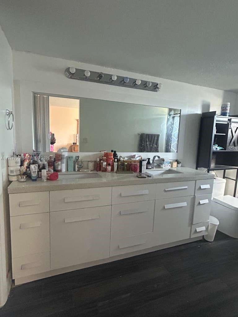 8020 Hampton Boulevard, Unit 202 North Lauderdale, FL 33068 - Photo 21 of 26 a bathroom with a sink and mirror