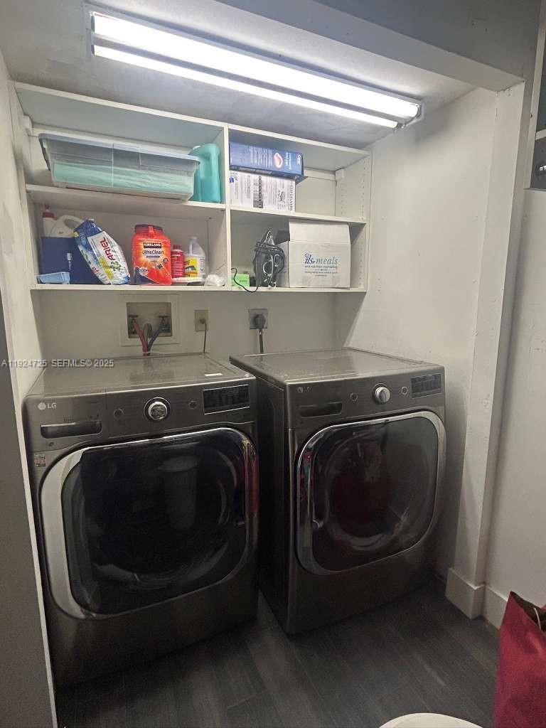 8020 Hampton Boulevard, Unit 202 North Lauderdale, FL 33068 - Photo 22 of 26 a utility room with dryer and washer