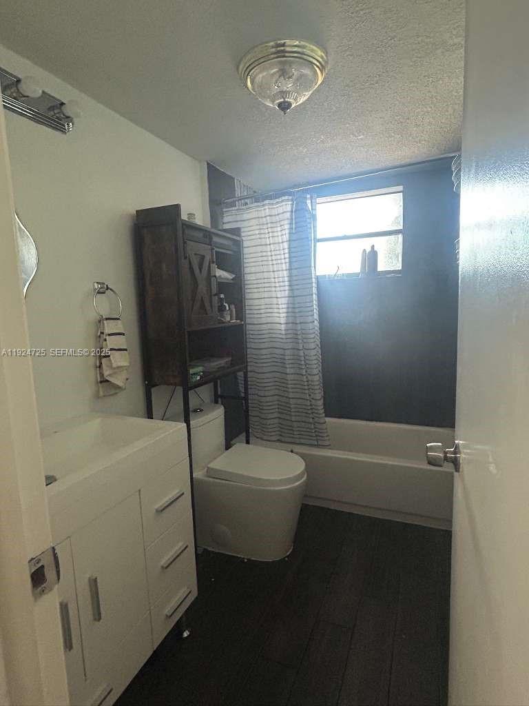8020 Hampton Boulevard, Unit 202 North Lauderdale, FL 33068 - Photo 24 of 26 a bathroom with a toilet a sink and bathtub