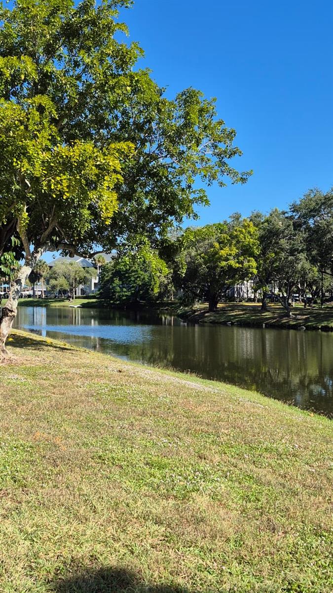 8020 Hampton Boulevard, Unit 202 North Lauderdale, FL 33068 - Photo 5 of 26 a view of a lake with houses