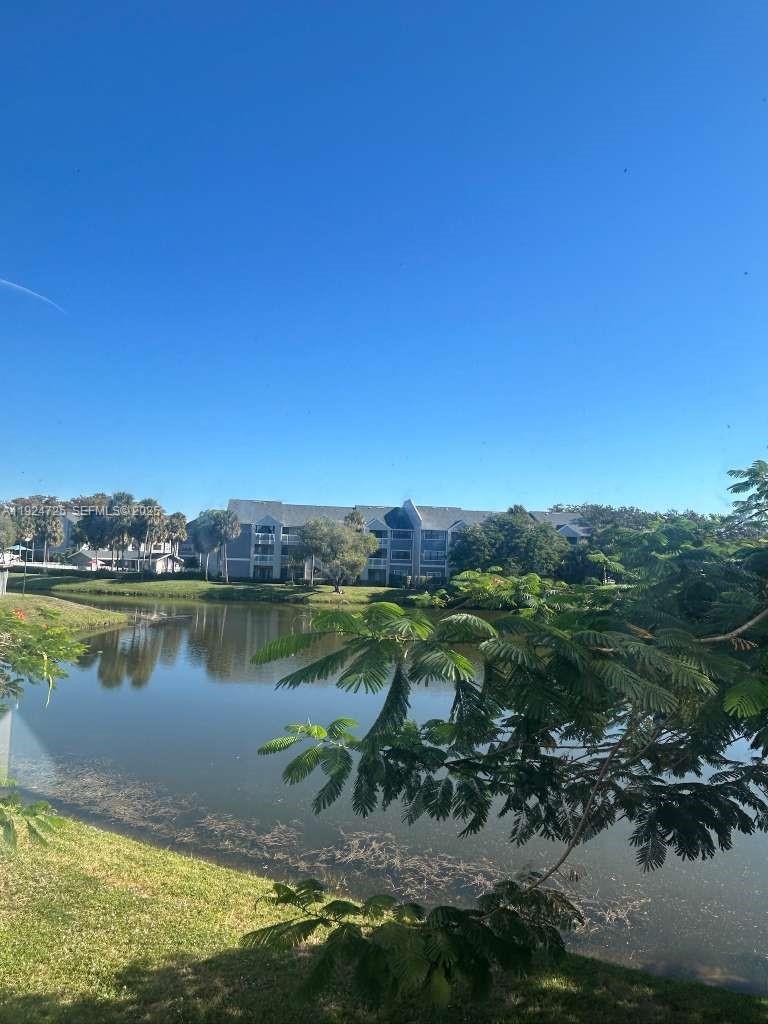 8020 Hampton Boulevard, Unit 202 North Lauderdale, FL 33068 - Photo 7 of 26 a view of a lake with a city