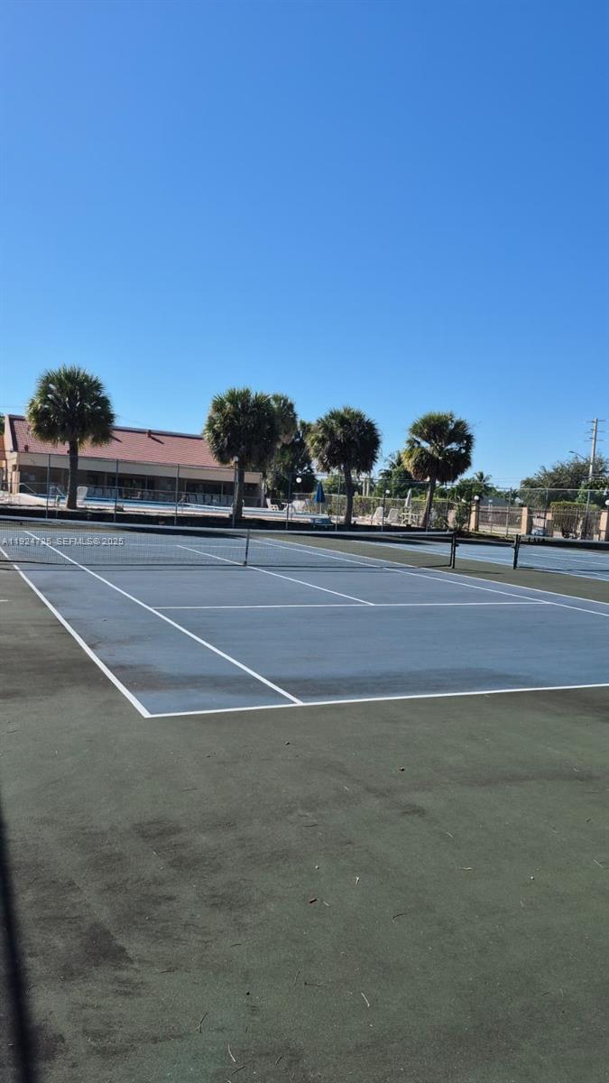 8020 Hampton Boulevard, Unit 202 North Lauderdale, FL 33068 - Photo 10 of 26 a view of a tennis court